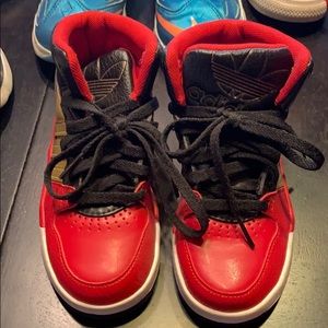 Adidas high top basketball shoes.